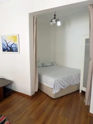 a bedroom with a bed and a wooden floor at Super Location Cosy Apartment TaximHome 3 at Taksim Cihangir in Istanbul