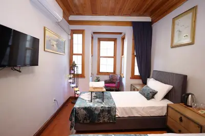 a hotel room with a bed and a tv at The Trip Anex Hotel in Istanbul