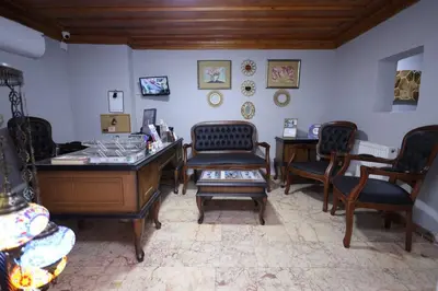 a room with chairs and a desk and a table at The Trip Anex Hotel in Istanbul