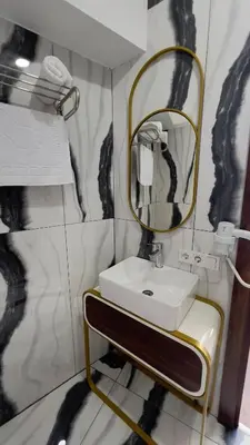 a bathroom with a sink and a mirror at Madrigal Boutıque Hotel in Istanbul