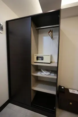 a black closet with a microwave in it at Visse Hotel in Mudanya