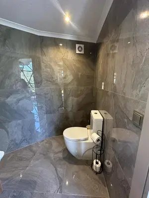 a bathroom with a toilet and a sink at Kalimeras Deluxe Hotel in Sapanca