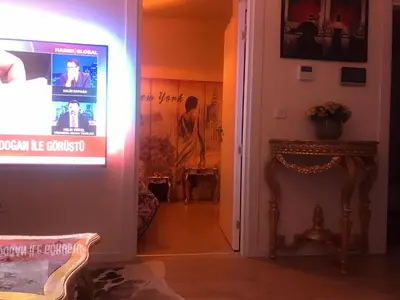 a living room with a movie poster on the wall at İstanbul Ataköy Residance Bakırköy Site İçi luxury daire in Istanbul