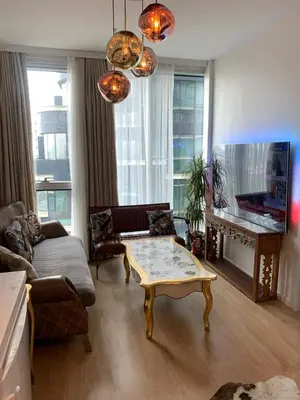 a living room with a couch and a coffee table at İstanbul Ataköy Residance Bakırköy Site İçi luxury daire in Istanbul