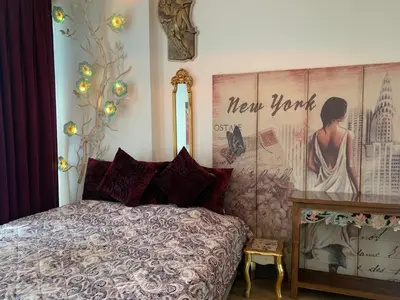 a bedroom with a bed and a poster on the wall at İstanbul Ataköy Residance Bakırköy Site İçi luxury daire in Istanbul