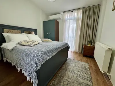 a bedroom with a large bed and a window at Modern Furnished Historical House in Istanbul