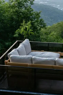 a white couch sitting on top of a balcony at PANA Sapanca Lake View in Sapanca