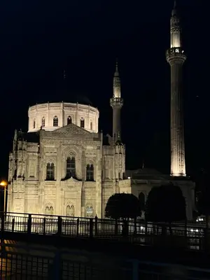 a lit up building with two towers at night at Falay Hotel Yavuz in Istanbul