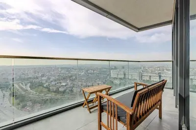 a balcony with a bench and a view of the city at Beautiful Elegant 1BD Private Terrace Gem! #333 in Istanbul
