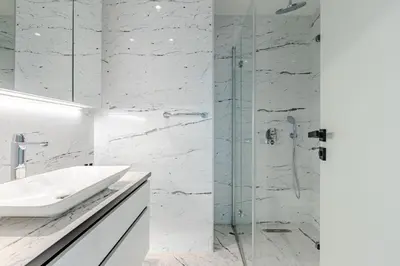 a white bathroom with a sink and a shower at Beautiful Elegant 1BD Private Terrace Gem! #333 in Istanbul