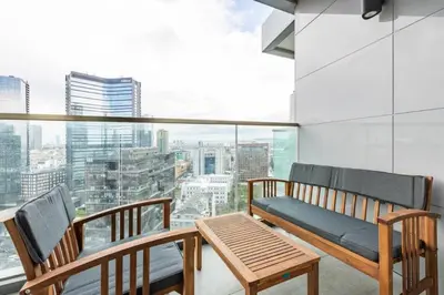 a balcony with a bench and a table in front of a window at Elegant 1BD Terrace Gem PoolParking! #344 in Istanbul