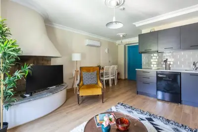 a kitchen and living room with a tv and a table at Stunning Bosphorus 2BD2Bath Views Terrace! #357 in Istanbul