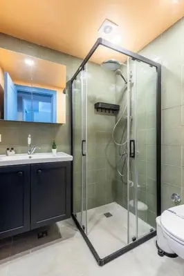 a bathroom with a shower with a sink and a toilet at Stunning Bosphorus 2BD2Bath Views Terrace! #357 in Istanbul