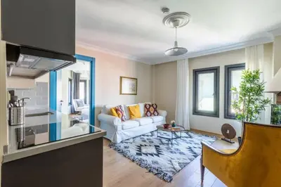 a living room with a white couch and a table at Stunning Bosphorus 2BD2Bath Views Terrace! #357 in Istanbul