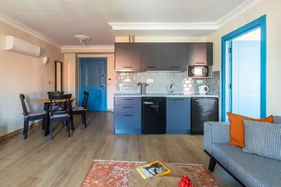 a kitchen and living room with a couch and a table at Gorgeous Airy 2BD2Bath Bosphorus Views! #358 in Istanbul