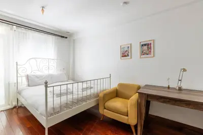a bedroom with a bed and a chair and a desk at Gorgeous Bright 2Bed1Bath Bosphorus Views! #356 in Istanbul