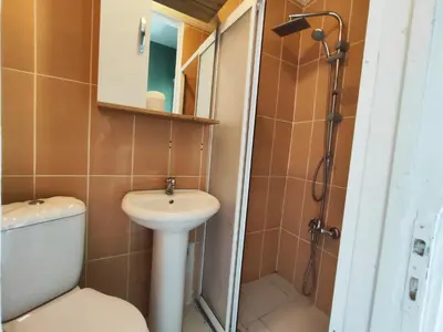 a bathroom with a toilet and a sink and a shower at Sweet Home in Istanbul