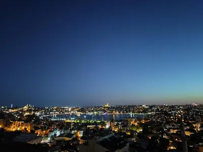a view of a city at night at Sweet Home in Istanbul