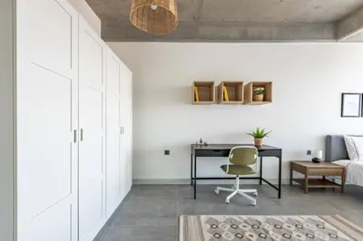 a bedroom with a desk and a bed and a chair at Gorgeous Bright Cool 1BD Residence Views! #359 in Istanbul
