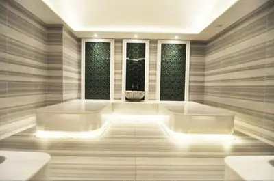 a bathroom with two white tubs and two windows at Gorgeous Bright Cool 1BD Residence Views! #359 in Istanbul