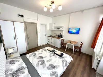 a small room with a bed and a table at Yellowhouse Room 4 in Istanbul