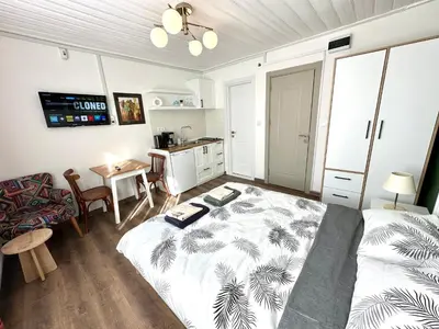 a bedroom with a bed and a table in it at Yellowhouse Room 5 in Istanbul
