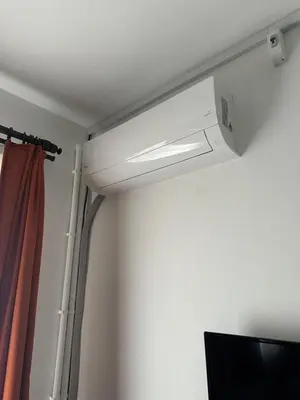a white ceiling light in a room with a curtain at Yellowhouse Room 2 in Istanbul
