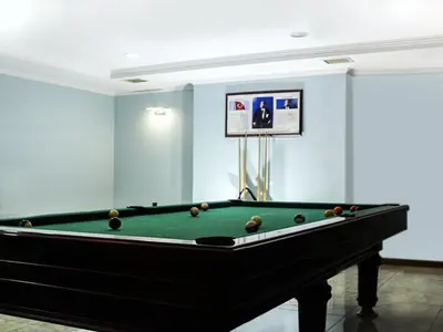a pool table in a room with blue walls at Helenapolis OTEL in Yalova