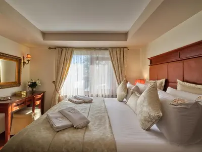 a bedroom with a large bed with two pillows on it at 1207 Hotel Special Class Sultanahmet in Istanbul