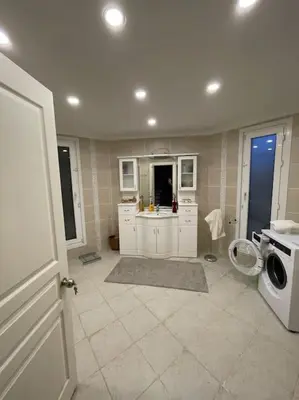 a kitchen with a sink and a washing machine at Villa Elegance in Kocaeli