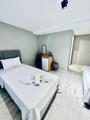 a bedroom with a large white bed in it at The Hera Gold Hotel in Istanbul