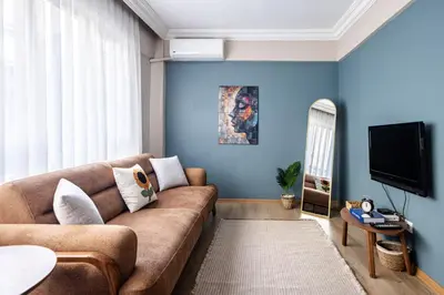 a living room with a couch and a tv at AKA Home in Istanbul