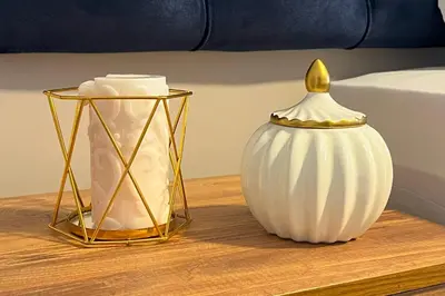 a table with a white vase and a gold at Bro Apartments Sultanahmet in Istanbul