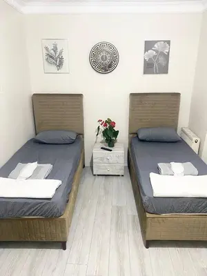 two beds sitting next to each other in a bedroom at Mimen Hostel in Istanbul