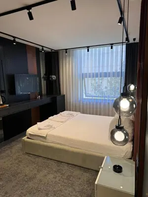 a bedroom with a bed and a window at Zeytin Hotel in Istanbul