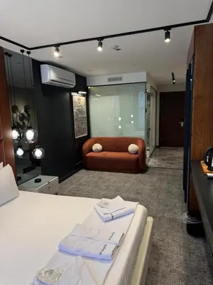 a living room with a couch in a room at Zeytin Hotel in Istanbul