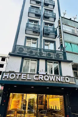 a hotel grown sign in front of a building at Crowned Exclusive Hotel in Istanbul