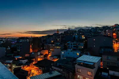 a view of a city at night at Roys Hotel & Suites in Istanbul