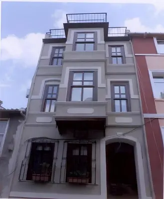 a tall white building with windows at Hotel No 34 in Istanbul