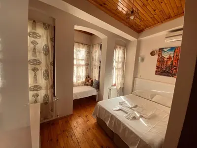 a bedroom with a bed and a tub in a room at Hotel No 34 in Istanbul