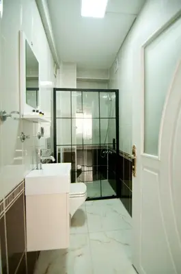 a bathroom with a toilet and a sink and a shower at Yakut Hotel in Istanbul