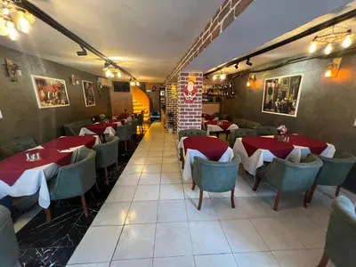 a restaurant with tables and chairs in a room at Yakut Hotel in Istanbul