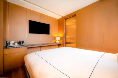 a bedroom with a bed and a flat screen tv at Sura Concept Hotel in Istanbul