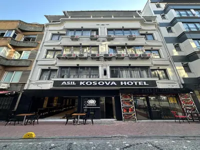 a building on a street with a hotel at Asıl Kosova Hotel in Istanbul
