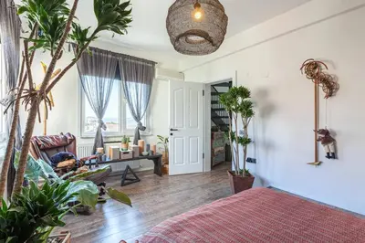 a living room with a bed and a couch at Panoramic Sea View Loft with Terrace BBQ in Istanbul
