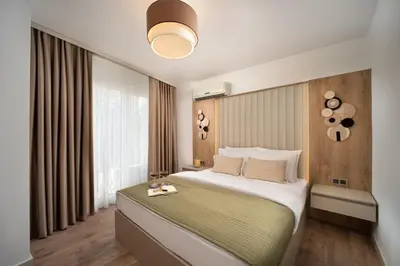 a bedroom with a large bed and a large window at Marmada Suites in Istanbul