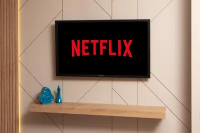 a television on a wall with the netflix sign on it at Marmada Suites in Istanbul