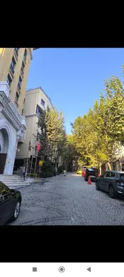 a city street with cars parked on a cobblestone street at Sultanahmet Apartment in Istanbul