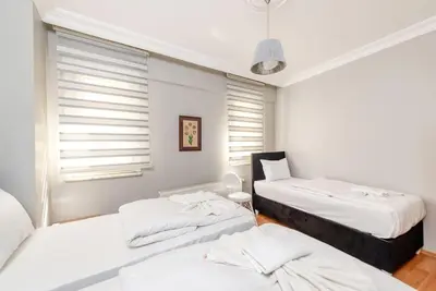 a bedroom with two beds and a window at Qbra House in Istanbul