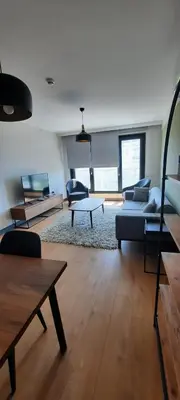 a living room with a couch and a table at NEW Modern Central 2BR 2BA in Istanbul